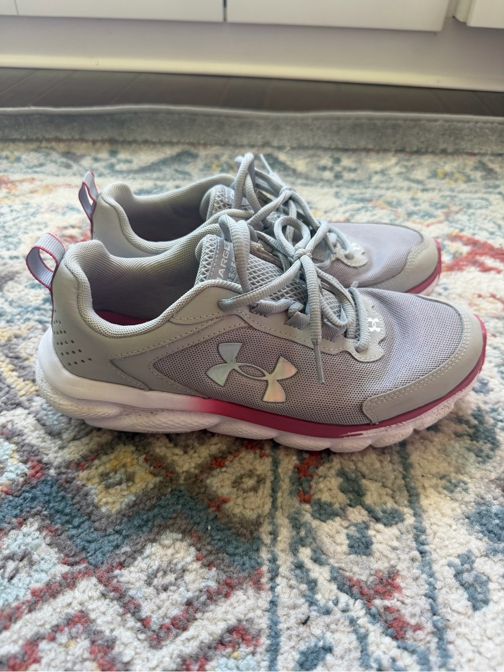 Under Armour Charged Assert Light Gray and Pink Athletic Sneakers
